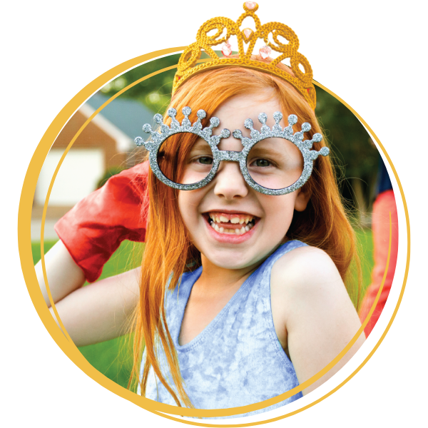 Young girl with crown, gloves, and glasses.