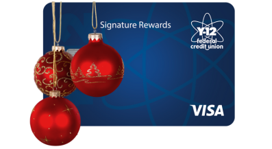 Image of the Signature Rewards Visa card with ornaments hanging from it