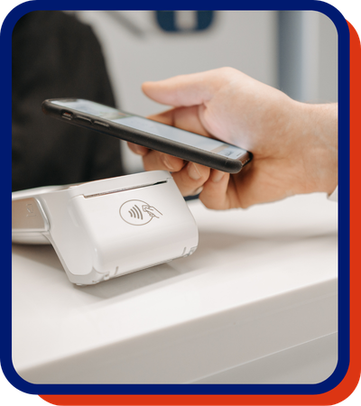 Person using Tap to Pay with a mobile phone.