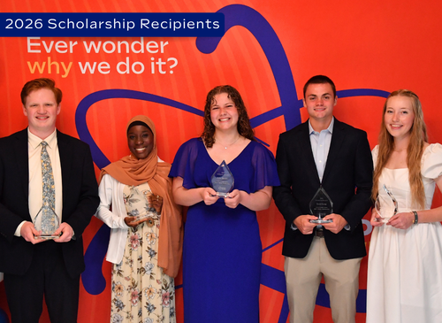Group photo of scholarship recipients with their awards.